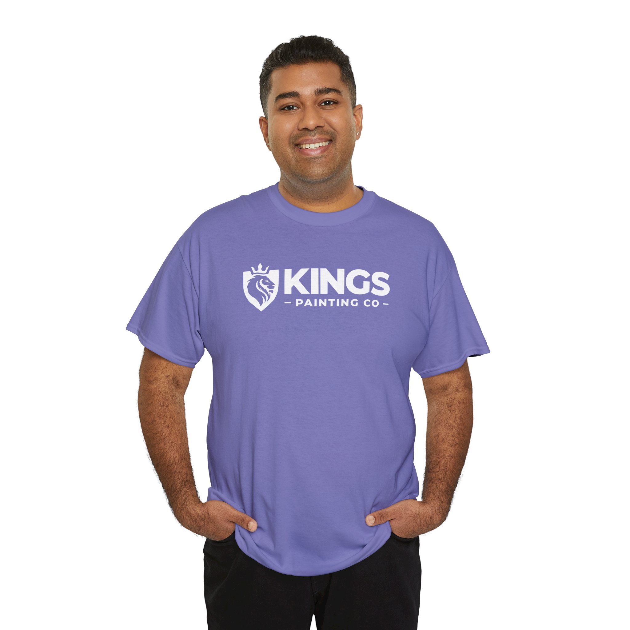 A smiling man wears the Kings Painting Co. Logo T‑Shirt (Classic) in lavender (Gildan Ultra Cotton G5000), featuring the Kings Painting Co. logo and lion emblem, standing with his hands in his pockets against a white background.