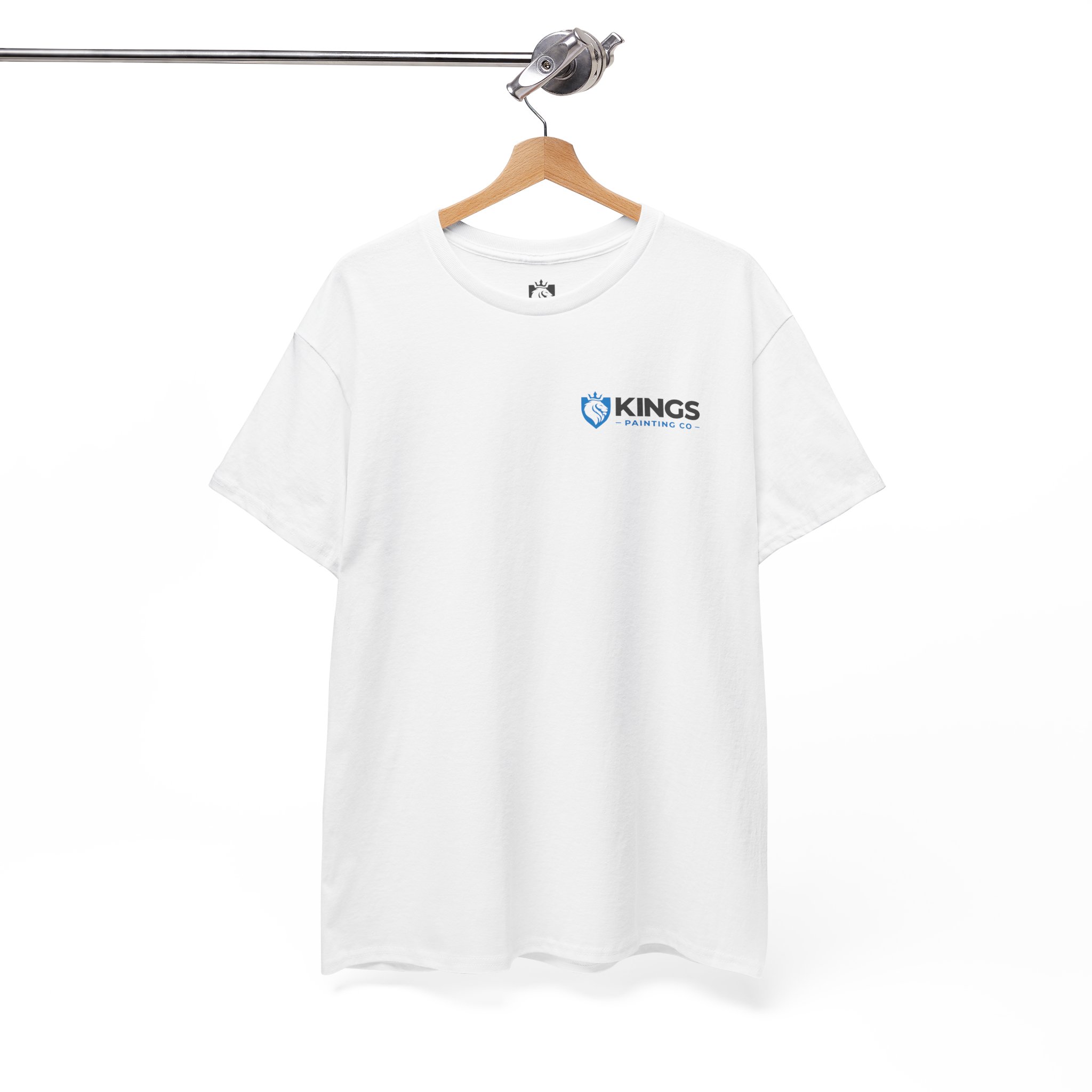 A white Kings Painting Co. Logo T‑Shirt (Pocket Logo & Back Graphic) by Gildan Ultra Cotton (G5000) hangs on a wooden hanger, displaying the company’s blue and black logo with a blue shield and paintbrush design on the upper left chest. The background is plain white.